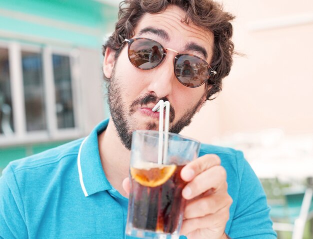 Close-up of man drinking a soda