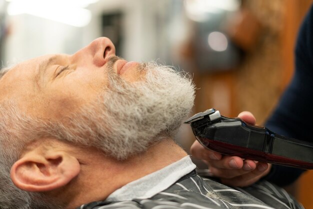 Close up man getting groomed at salon