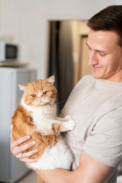 Close up man holding cat