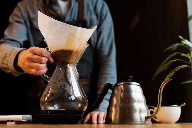 Close-up of man holding coffee filter