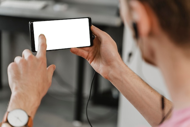 Close-up man holding smartphone