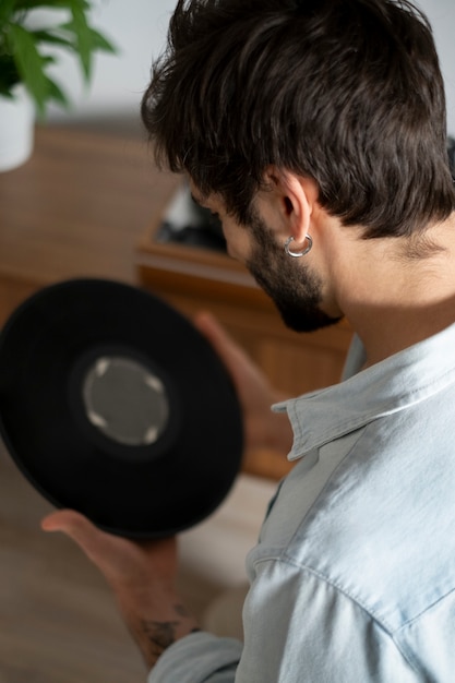 Close up man holding vinyl disc