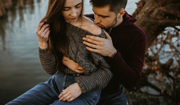 Free Photo close-up man kissing woman's shoulder