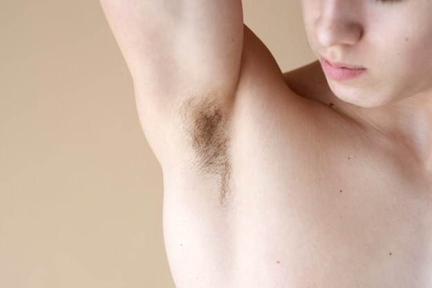 Close up on man revealing her armpit