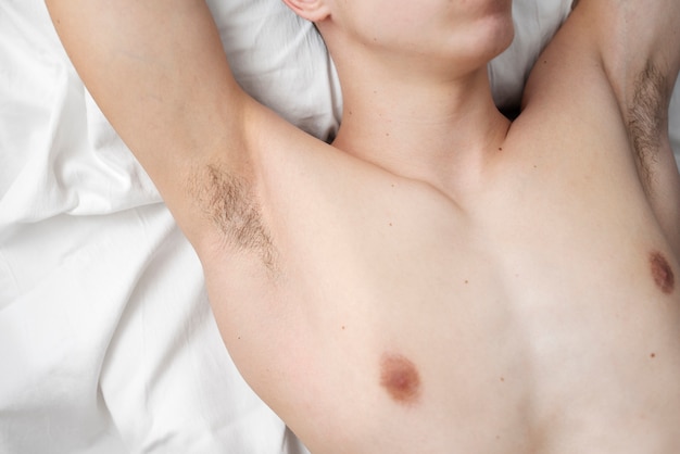 Free Photo close up on man revealing her armpit