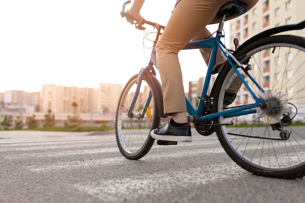 Close up man riding bicycle