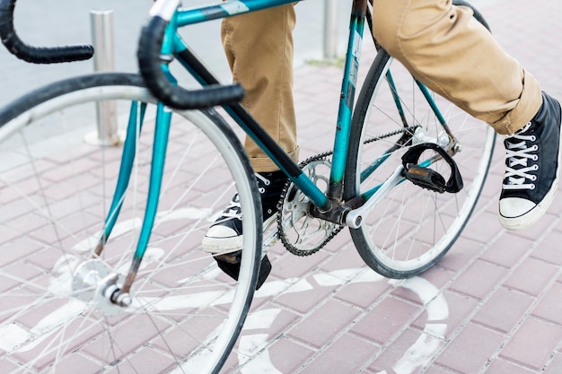 Close-up man riding his bicycle