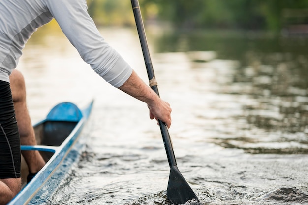 Close-up man rowing