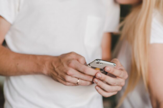 Close-up of man's hand using cellphone