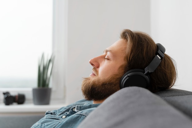 Close up man sleeping with headphones