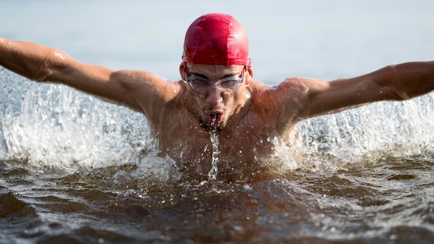 Close-up man swimming in lake