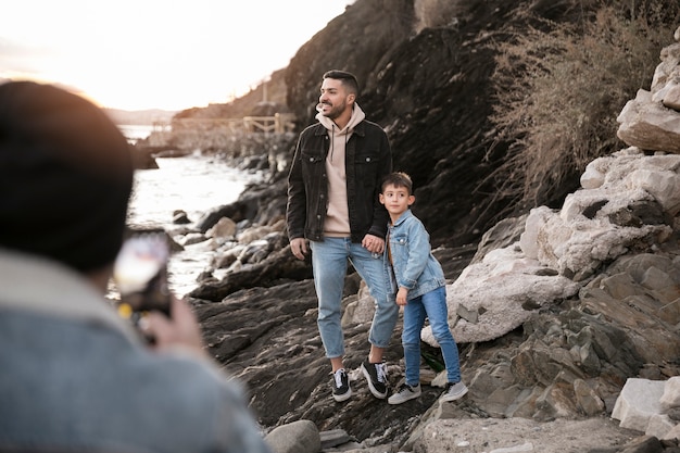 Close up man taking family photos