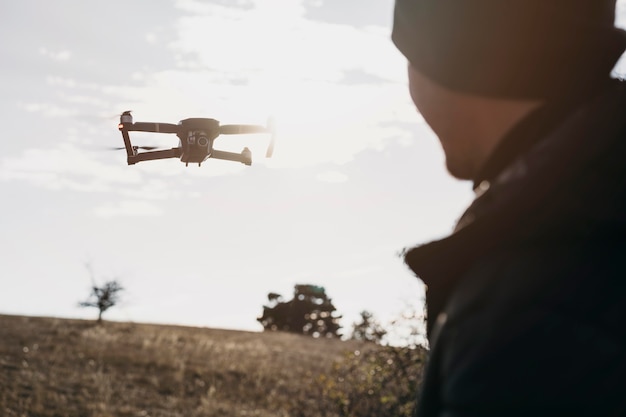 Free photo close-up man watching drone