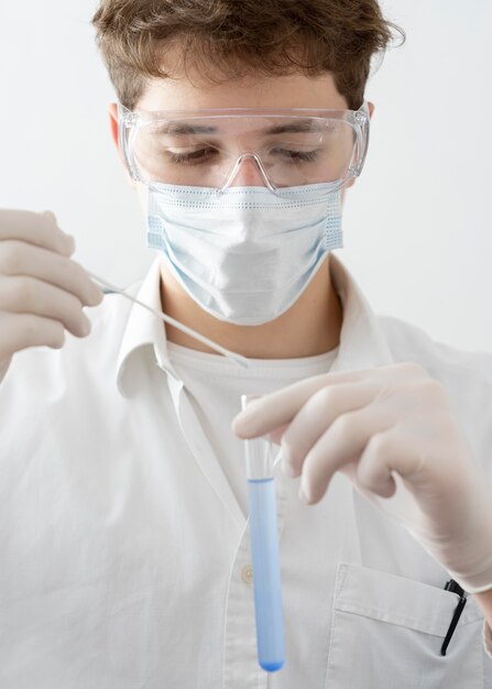 Close-up man wearing mask and goggles