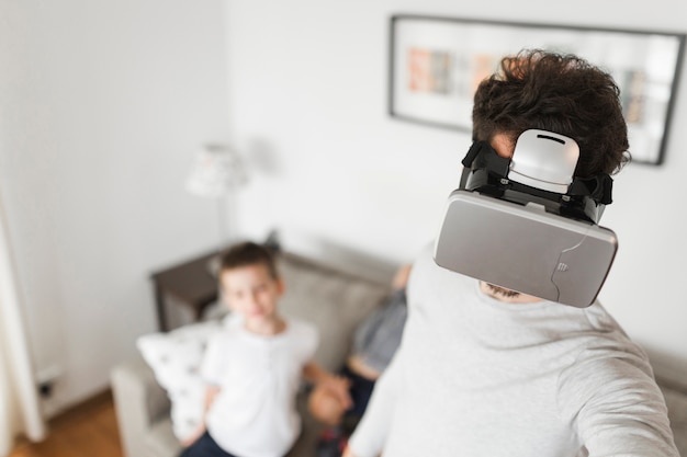 Free Photo close-up of a man wearing virtual reality glasses