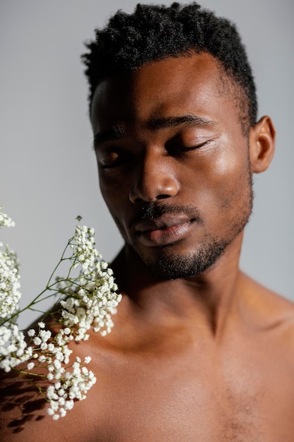 Close-up man and white flowers