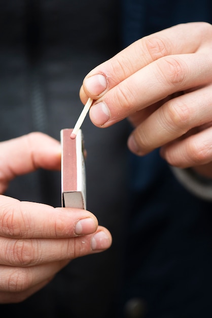 Close-up man with matches