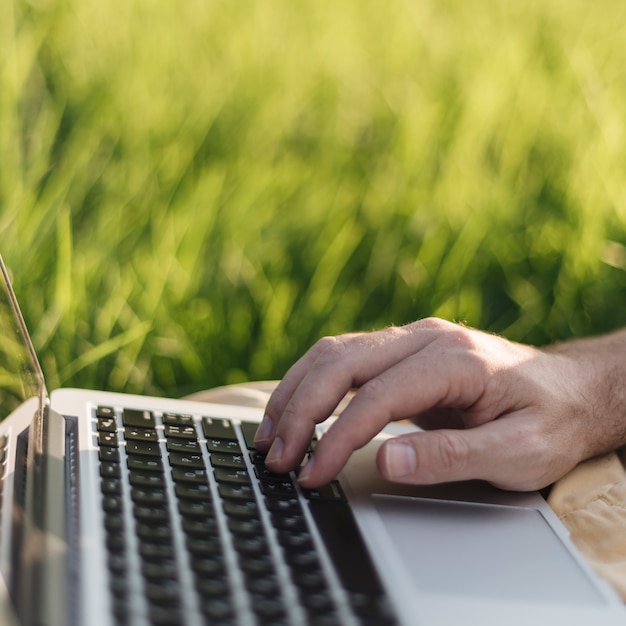 Free Photo close up of man working with laptop