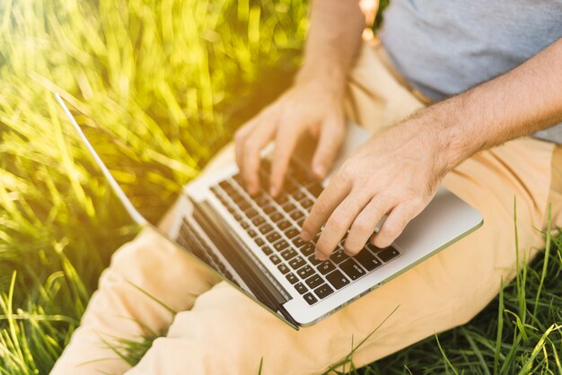 Close up of man working with laptop