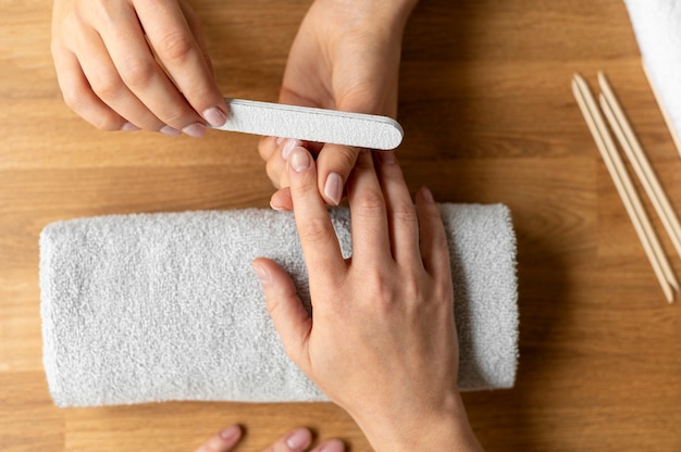 Close up manicure concept with nail file