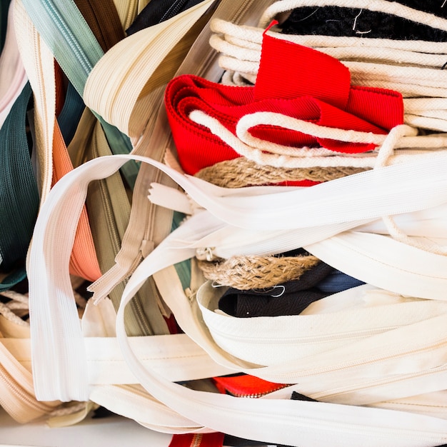 Close-up of many zippers in tailor shop