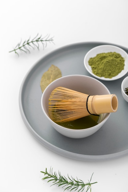 Free photo close-up matcha powder and bamboo whisk