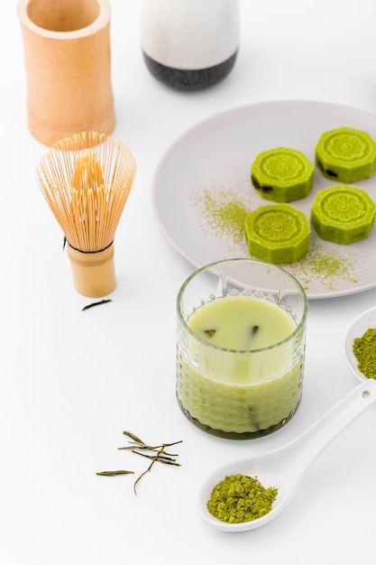 Close-up matcha tea with bamboo whisk