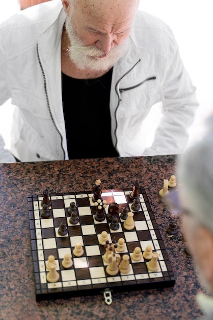 Free Photo close up men playing chess