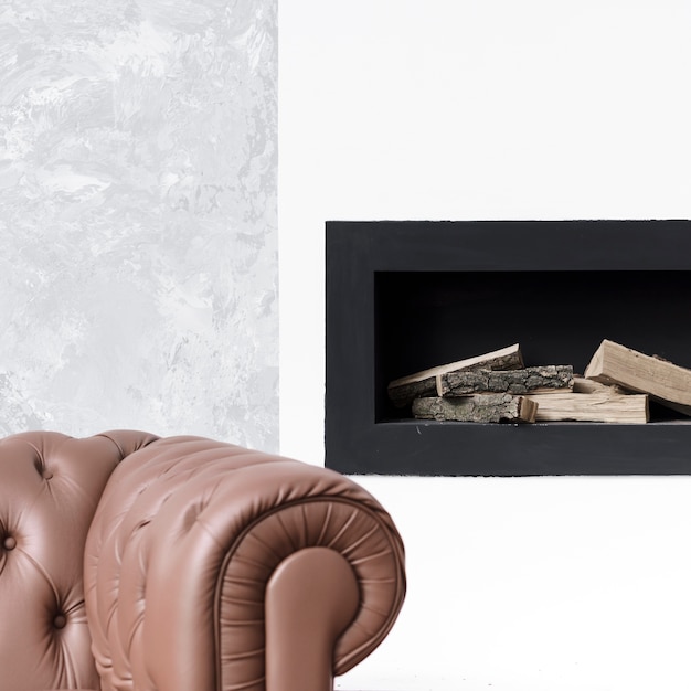 Free Photo close-up minimalist fireplace  and sofa