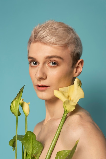 Free photo close up model holding flowers