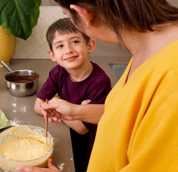 Close up mother and boy cooking  together