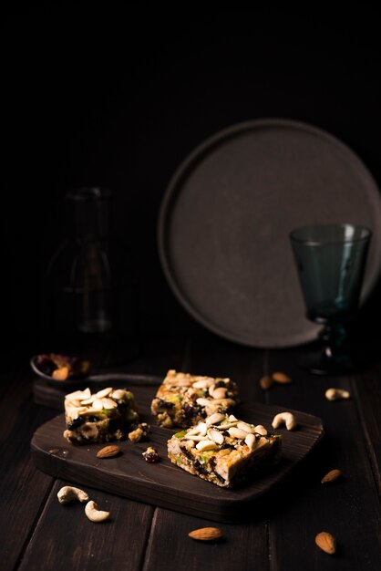 Free photo close-up muesli batons on wooden board