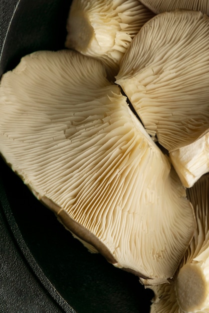 Free Photo close up mushrooms in pot