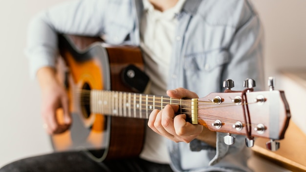 Close-up musician playing the guitar