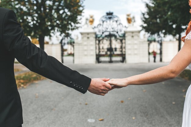 Free Photo close-up of newlyweds holding hands