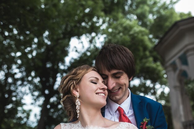 Close-up of newlyweds smiling