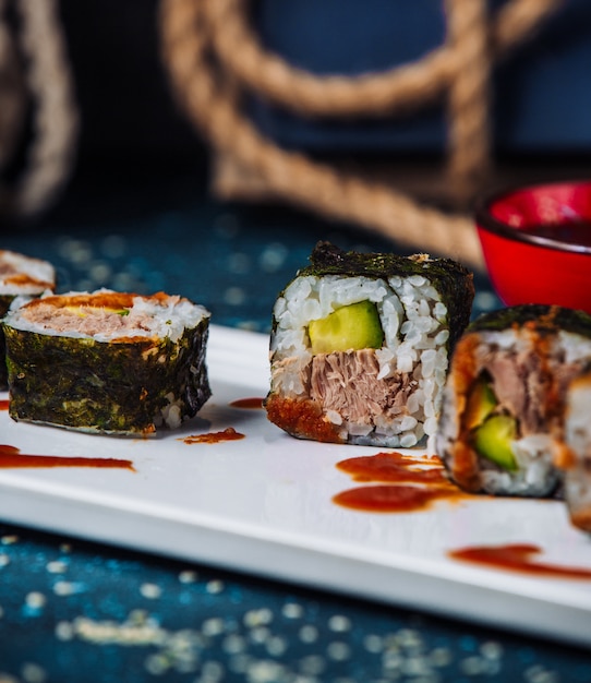 Free Photo close up of nori sushi rolls with tuna and cucumber