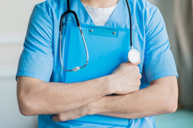 Close-up nurse holding clipboard