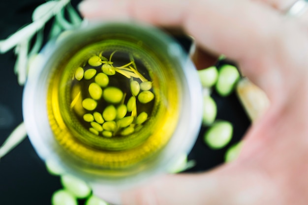 Close-up of olive oil in glass