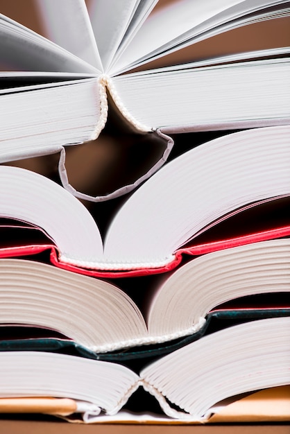 Close-up of open books with covers of different colors