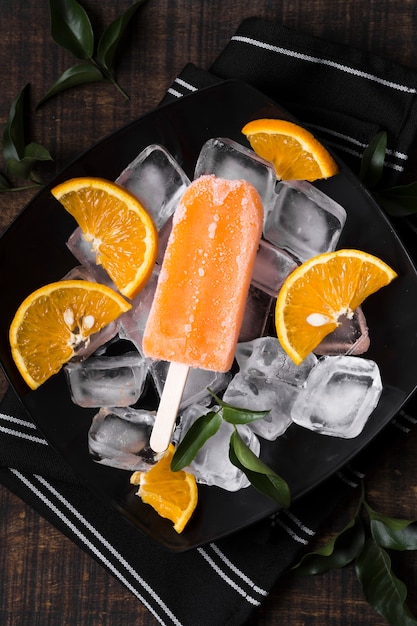 Free photo close-up orange ice cream sticks