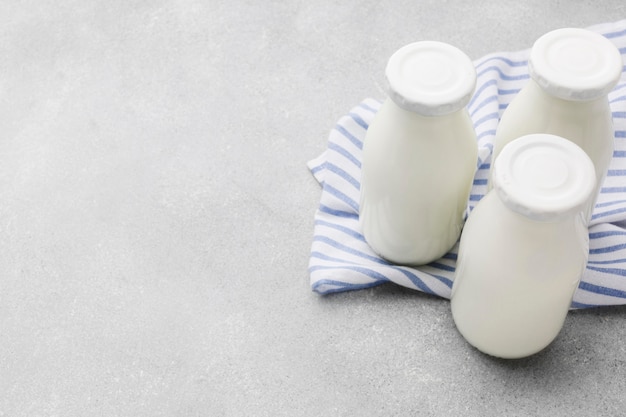 Free photo close-up organic milk bottles with copy space