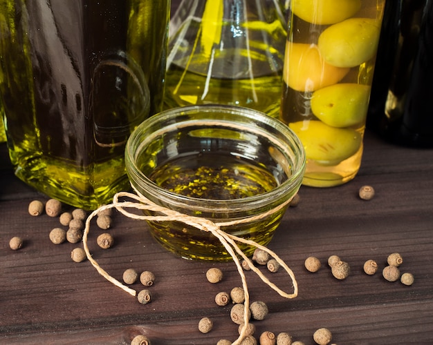 Free photo close-up organic olive oil on the table