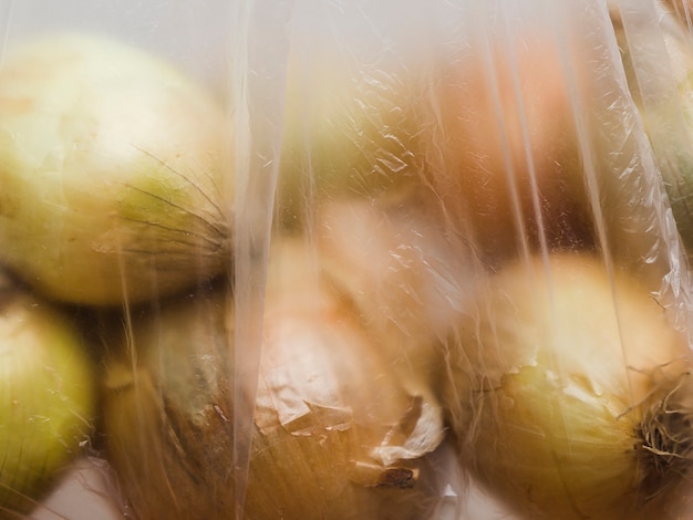 Free photo close-up of organic onion in plastic bag