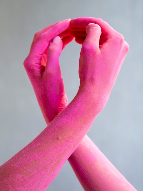 Close-up painted arms expressing cancer awareness