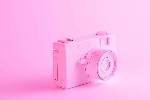 Free photo close-up of painted camera against pink background