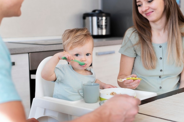 Close up parents with kid eating