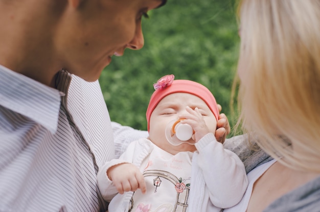 Close-up of parents with their sleeping baby