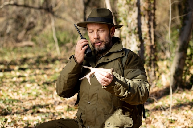 Close up on park ranger in woods