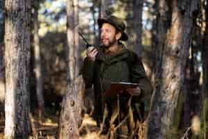 Free photo close up on park ranger in woods